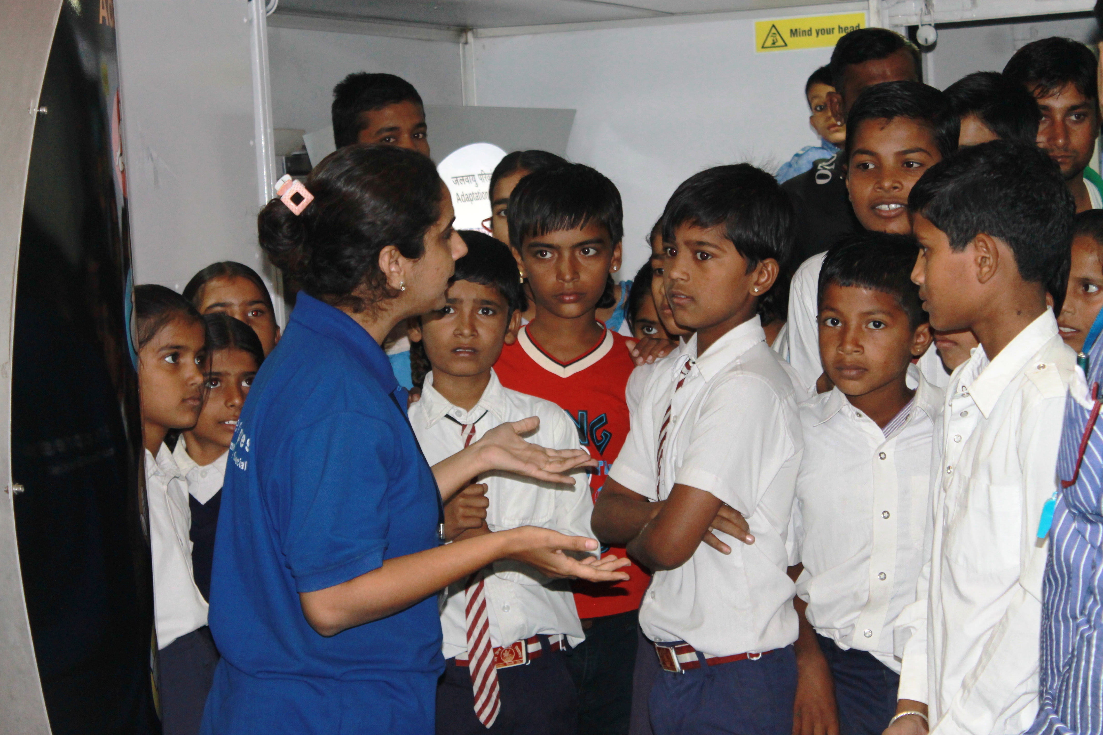 Science Communicator explaining to queries of School Students