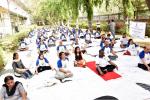PARTICIPANTS PERFORMING YOGIC EXERCISE DURING HAPPINESS PROGRAMME CONDUCTED BY THE ART OF LIVING, ON 21ST JUNE, 2018 AT DST PREMISES