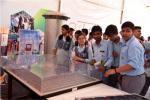 Students of Navyug School, New Delhi, with a Model of Shallow Emitter Silicon Solar  Cell displayed in the Exhibition during Swachhta Pakhwada